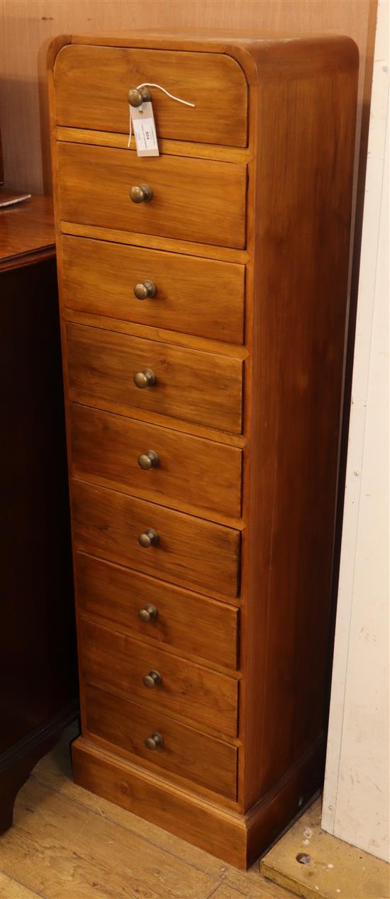 A contemporary narrow chest of drawers H.130cm